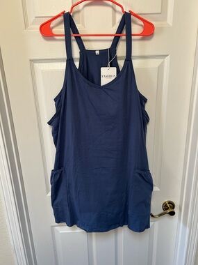 Athletic dress with attached bodysuit